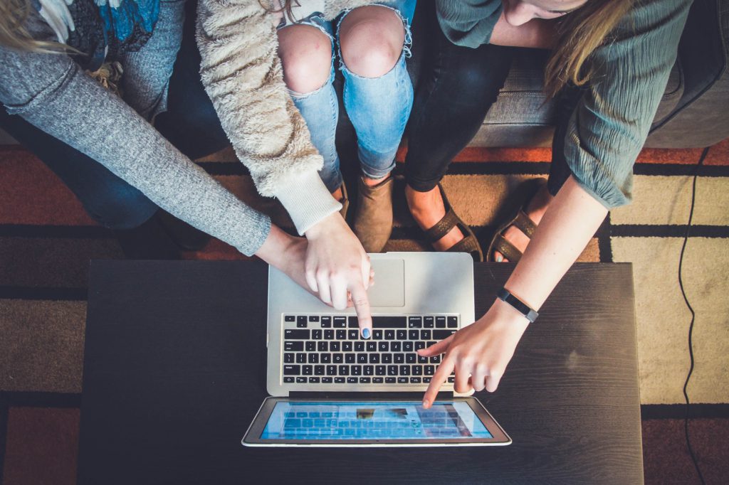 People helping another consumer shop online